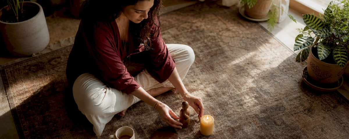 Woman arranging symbolic personal business ritual items