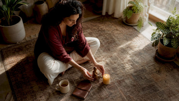 Woman arranging symbolic personal business ritual items