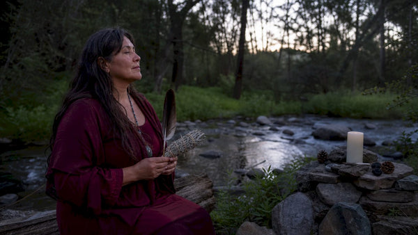 Indigenous woman performing ancestral healing ritual