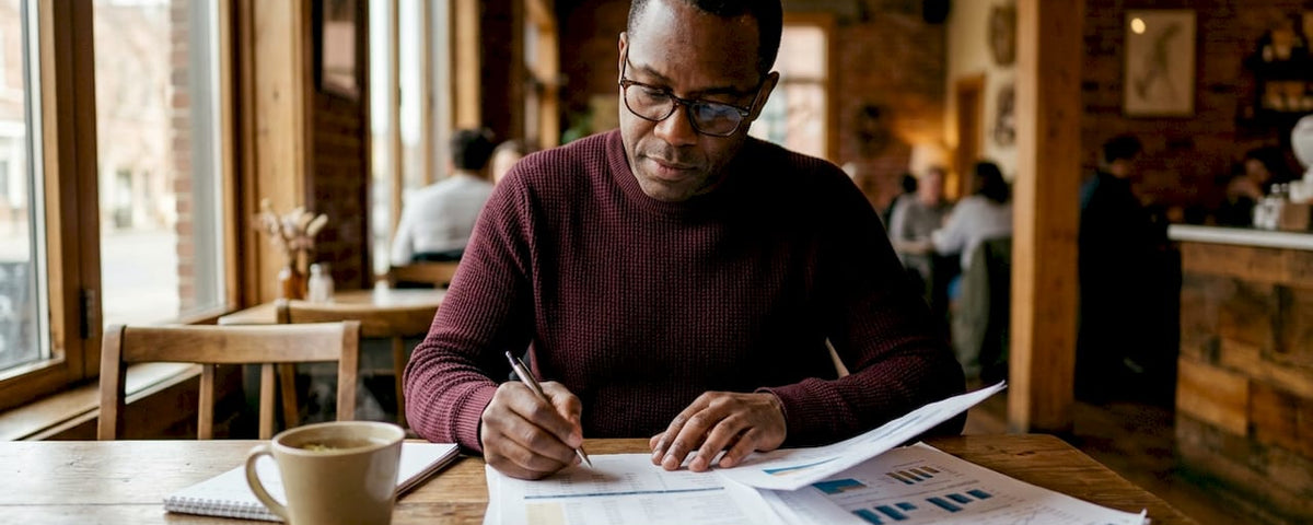 Business analyst reviewing energy cost reports
