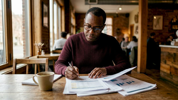 Business analyst reviewing energy cost reports