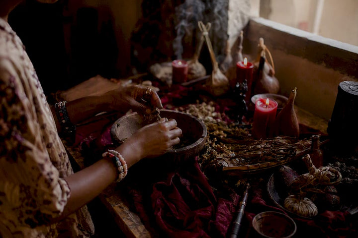 Hands performing West African love spell ritual