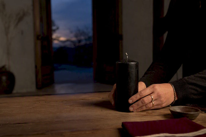 Black candle prepared for banishing ritual