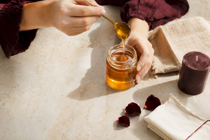 Hands preparing an ethical honey jar ritual