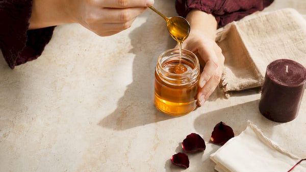 Hands preparing an ethical honey jar ritual
