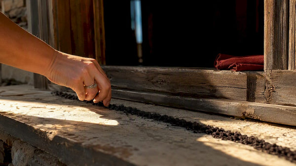 Black salt line across doorway threshold